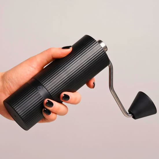 nuttii-goosey-hand-coffee-grinder-in-hand-web